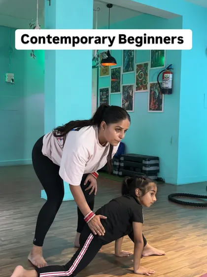 A clear example of a lunge correction. I'm guiding the student's hips to ensure they are square to the front, which is fundamental for achieving balanced splits and preventing hip imbalances.