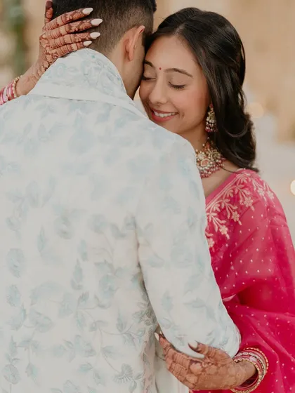 A quiet embrace between Kajal and Ram. This photo focuses on their connection, capturing a moment of peace and love amidst the excitement of their wedding events.
