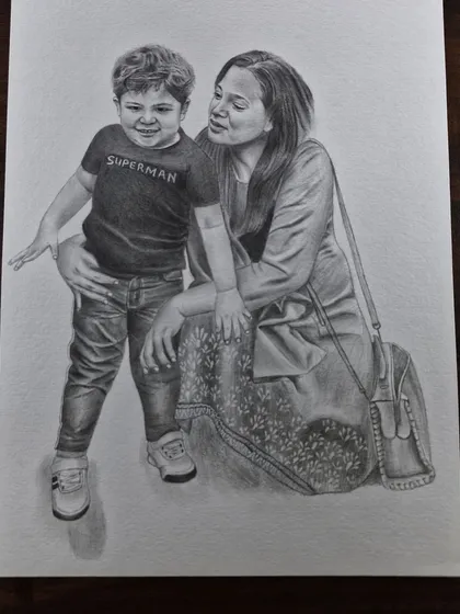 A tender moment between a mother and her son, drawn with graphite pencil. These family portraits are designed to be treasured for years.