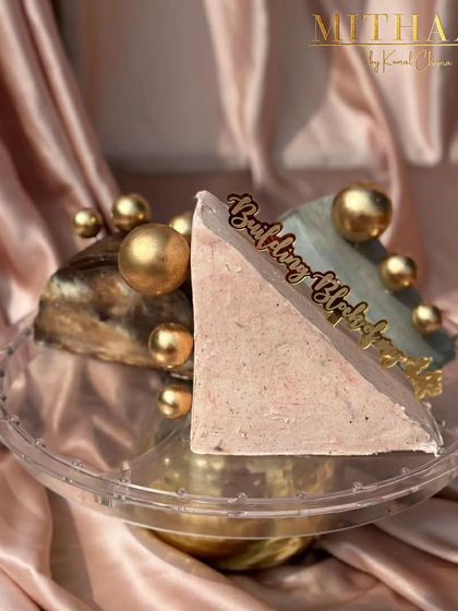 A different view of my sculptural cake design, showing how I play with form and structure. The combination of pink and grey frosting, both naturally colored, creates a beautiful contrast against the metallic gold accents.