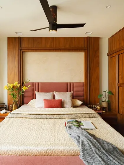 The master bedroom exudes classic elegance with a white and wood color palette. The bed and wardrobe are crafted from solid wood, creating a serene and natural atmosphere perfect for a tranquil retirement space.