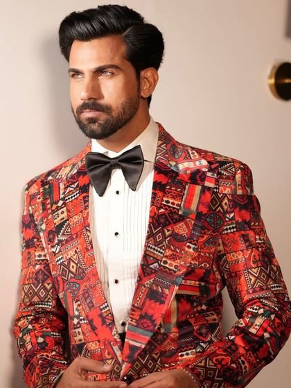 A close-up of the Cantaloupe Tuxedo, revealing the intricate details of the fabric's pattern and the sharp cut of the lapel.