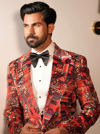 A close-up of the Cantaloupe Tuxedo, revealing the intricate details of the fabric's pattern and the sharp cut of the lapel.