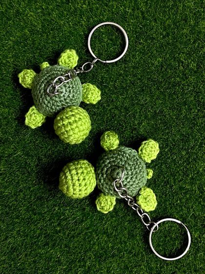 Another shot of the classic green turtle keychains, highlighting the detailed stitch work on their shells.