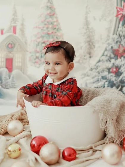 Hello Christmas baby! This little one's happy smile in her festive setup is enough to make anyone's holiday season merry and bright.