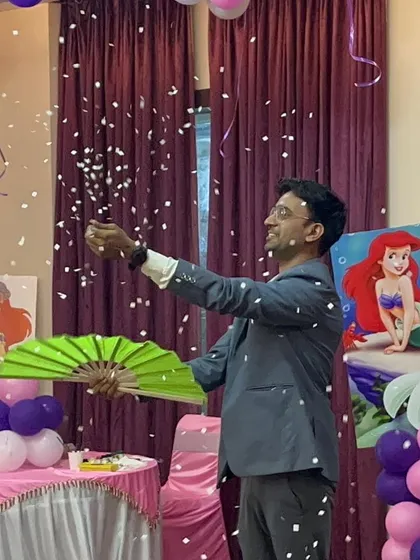 Performing my "snowstorm" illusion at a mermaid-themed birthday party. The falling snow adds a touch of enchantment to the celebration.