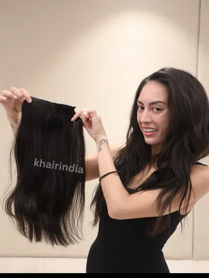 Miss Environment Philippines holding her 18-inch brown extensions before application. We customize the length and color to ensure a perfect, natural-looking match for every client.