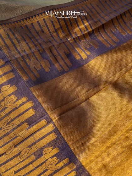 A close-up of the unique bamboo-inspired motifs on the brass zari border.