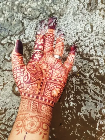 An artistic shot of the fresh henna stain against the water. You can see the clarity of the lines and the beautiful initial color.