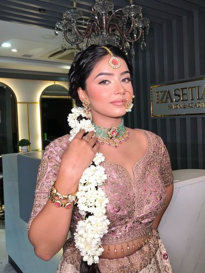 The complete bridal look, with the beautiful floral braid and the stunning pastel lehenga. Every detail is thoughtfully curated.