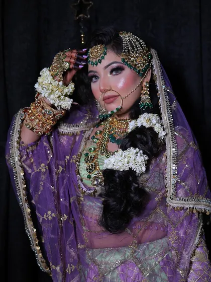 The complete look, showing the intricate jewellery including the passa, choker, and haath phool, all available for rent with the lehenga.