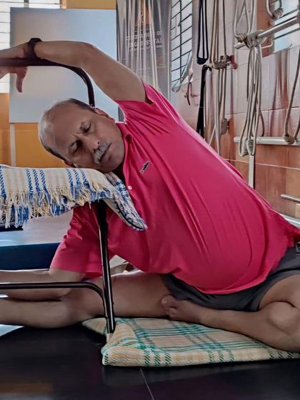 A seated side bend with a chair.