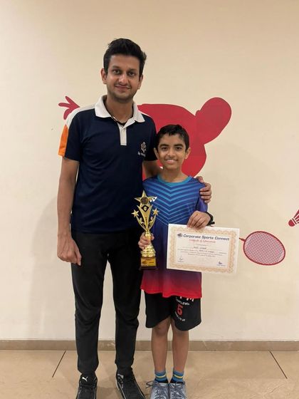 Vihaan Naik, our under-15 champion from the same CNS Badminton Tournament, proudly holds his trophy. It is rewarding to see multiple students excel at the same event.