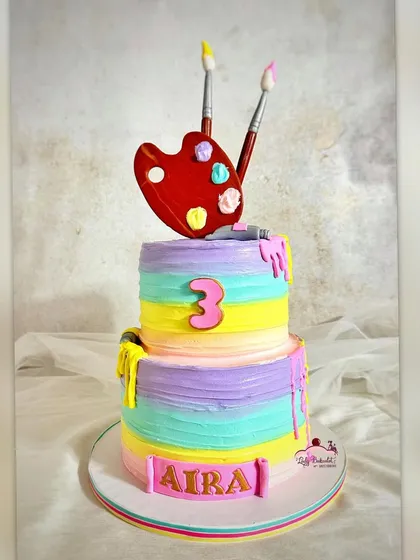 An artsy paint-themed cake with a rainbow pastel palette. I love how bright and cheerful this turned out.