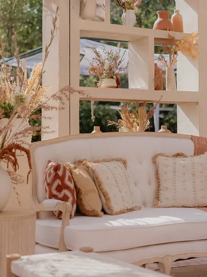A detailed shot of the sofa and its styling. I pay close attention to the textiles, like these textured and patterned cushions, to create a rich and inviting look.