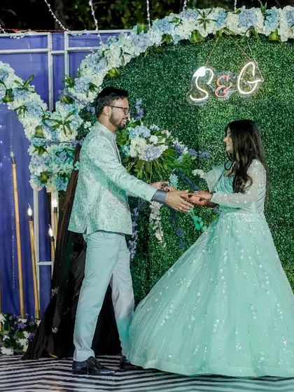 The groom leads his bride in a graceful turn. I teach basic partner work that looks elegant and is easy for anyone to learn.