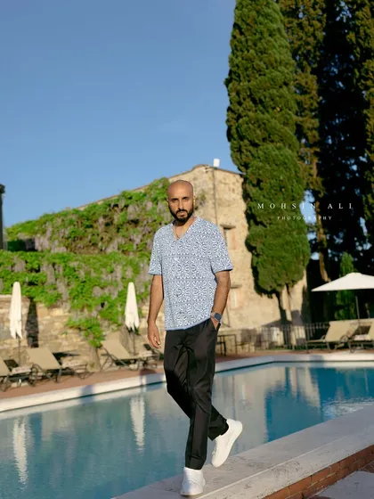 Walking by the pool at a stunning Tuscan villa before the evening's events. It's important to connect with the space to curate the perfect musical journey.