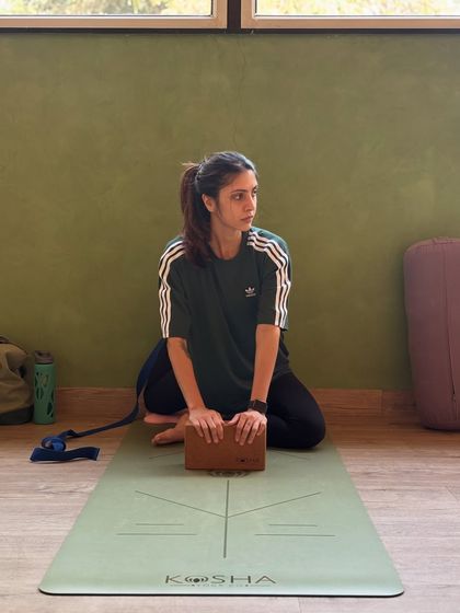 A moment of focus. Even simple seated poses with a block can help improve posture and create a mindful connection to the body.