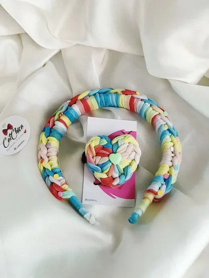 The 'Beach Vibes' colorway of our Princess Braid headband and heart hair tie set. The mix of bright colors is perfect for summer.
