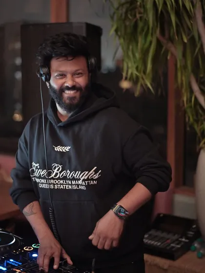 A smile behind the decks says it all. I genuinely love what I do, and that energy connects with the crowd every time.