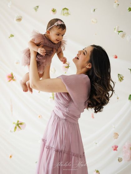 A duplicate of the hero image, this shot continues to showcase the dynamic and joyful interaction that defines this beautiful mother-daughter portrait.