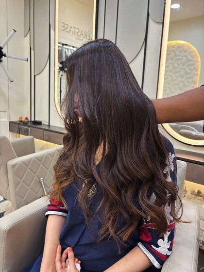 Another view of this sophisticated balayage, showing the soft waves and healthy shine.