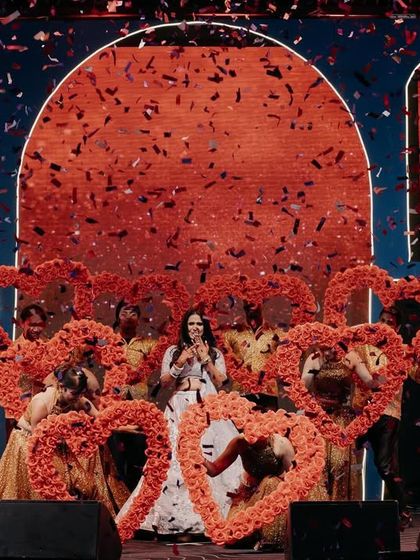 A bride's solo that is all heart. For this performance, we used heart-shaped floral props and a confetti blast to create a romantic and celebratory feel.