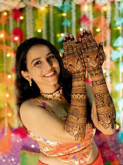 The bride looking absolutely radiant with her completed bridal henna.