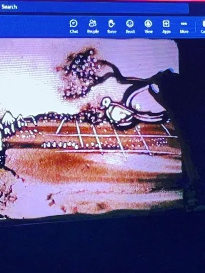 A view of my art on the monitor during a virtual corporate show. I adapt my performances for both live and digital audiences to create an engaging experience.