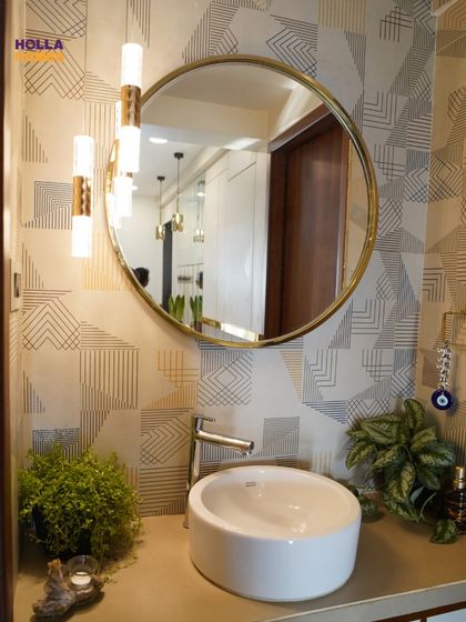 A closer look at the basin area, highlighting the modern vessel sink, stylish wall-mounted lights, and the beautiful texture of the wallpaper.