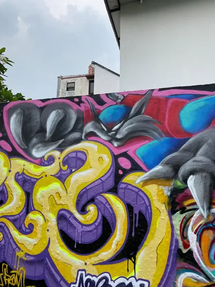 A different angle of the Jakarta piece, showing the character's claws reaching over my letters. It's a real collaboration.