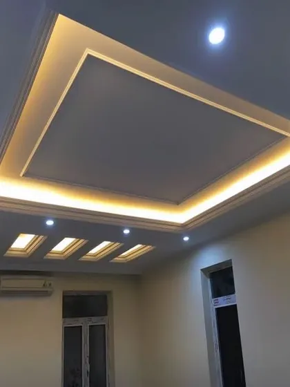A classic tray ceiling design elevated by beautiful, warm cove lighting. This technique provides a soft, indirect glow that makes a room feel cozy and sophisticated.