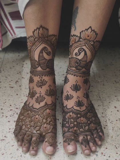 A lovely foot design combining two favorite motifs: the graceful peacock and the sacred lotus flower.