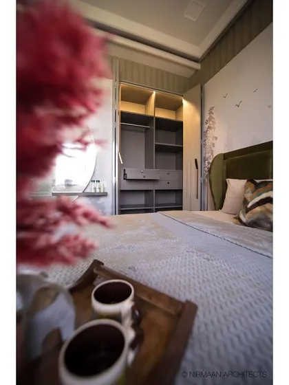 A close-up of the wardrobe and dressing area in this master bedroom. The design shows how we integrate storage solutions that are both practical and beautiful.