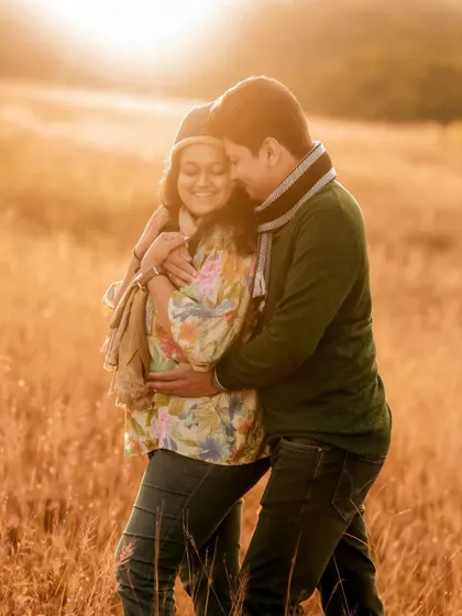 I believe the best light for capturing love is the sun's golden farewell. This intimate moment between an expecting couple, wrapped in the warm glow of sunset in a quiet field, is the kind of timeless, romantic memory I strive to create.