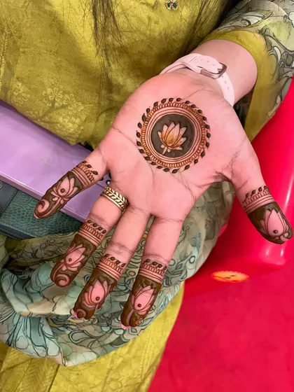 A simple and sweet lotus mandala on the palm. This is a perfect example of how a small design can make a big impact.