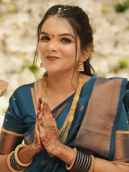 A close-up of the bride's happy face during the ceremony, showing how the makeup enhances her features naturally.