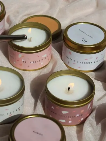 These golden tin jar candles are perfect for white-labeling. The image shows how different custom labels can create a unique look for your brand, whether you prefer a minimalist or a patterned design.