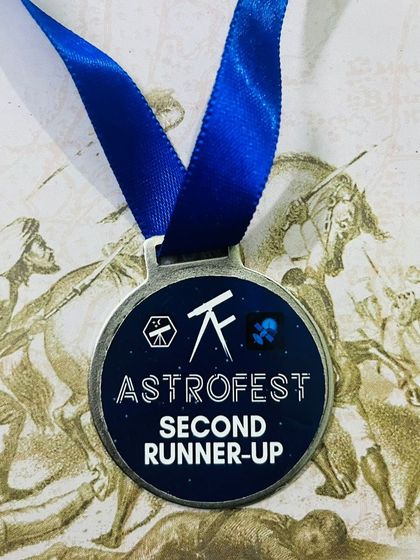 A close-up of the medal won by our student Aadi at Astrofest 2025. His success in an astronomy quiz competition shows how the skills learned with us apply across different subjects.