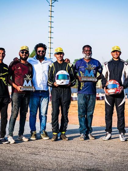 The team celebrating a double podium finish on the track.
