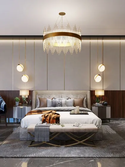A beautifully curated bedroom with a statement crystal chandelier, elegant wall paneling, and a mix of textures that create a sophisticated and comfortable retreat.