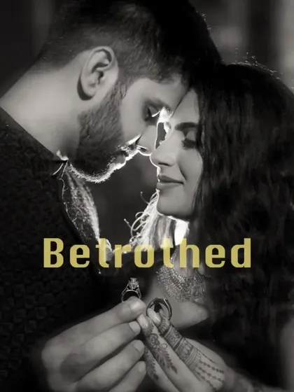 A stunning black and white shot capturing the moment of betrothal, with the couple holding their rings in the foreground. A truly symbolic and artistic portrait.