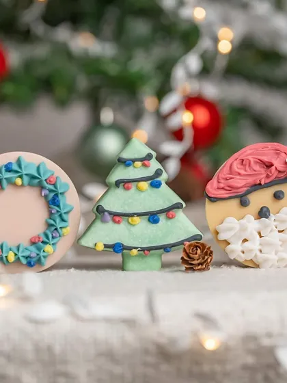 A festive trio of Christmas-themed soaps: a wreath, a tree, and Santa Claus. This group shot is perfect for holiday marketing campaigns.