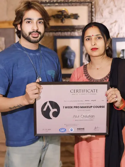 Awarding a certificate to a student from our one-week pro course. She learned quickly and showed great skill.