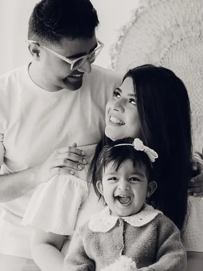 A classic family-of-three portrait in black and white. The love and happiness in their expressions are what truly matter.