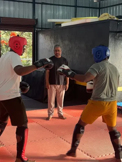 Stance and readiness are key in any fight. Here, two students face off, ready to begin their sparring practice under my watchful eye.