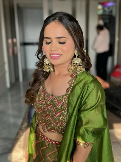 Eyes closed to show the soft, neutral eyeshadow. For a Mehendi look, I often keep the eyes simple to let the colourful outfit and intricate henna shine.