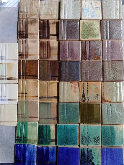 The chemistry of pottery is a world of its own. These are glaze test tiles from one of our masterclasses, each a small experiment in color and texture. Understanding these materials is key to moving from a craftsperson to an artist.