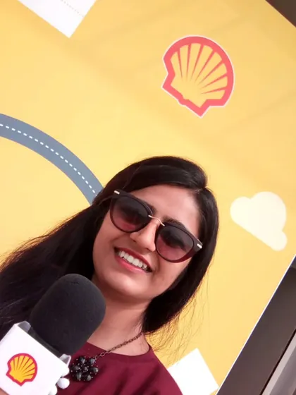 A close-up shot while hosting for Shell. A genuine smile and professional presence are essential for connecting with an audience, whether I am on a large stage or interacting with people one on one.