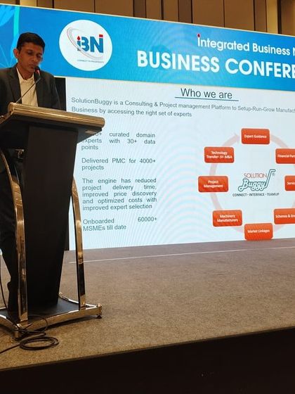 Our CTO, Guruprasad Bangle, is pictured here speaking at the IBN 20 Business Conference. He is presenting a slide about our company, demonstrating our active role in shaping industry conversations and sharing our expertise.